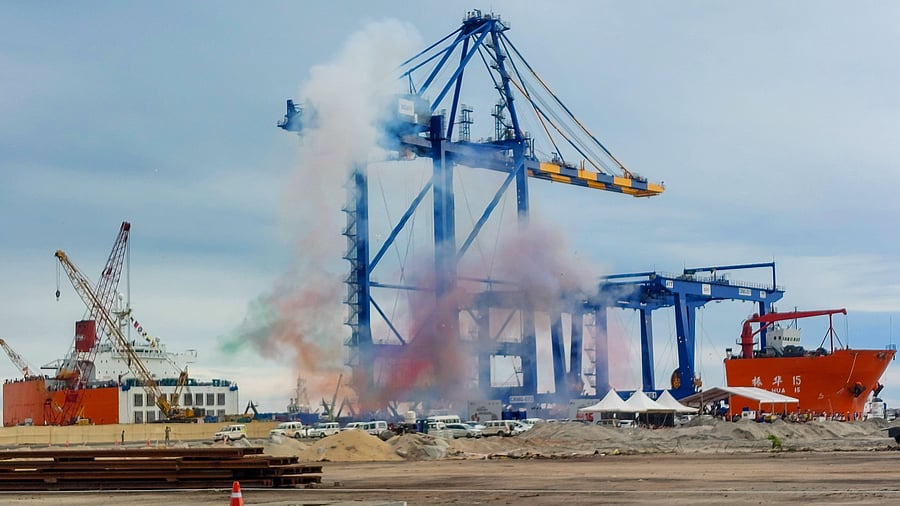 <div class="paragraphs"><p>Coloured fumes rise in the sky as the first ship carrying port equipment given an official reception at Vizhinjam International Seaport Limited, in Thiruvananthapuram, October 15, 2023. </p></div>