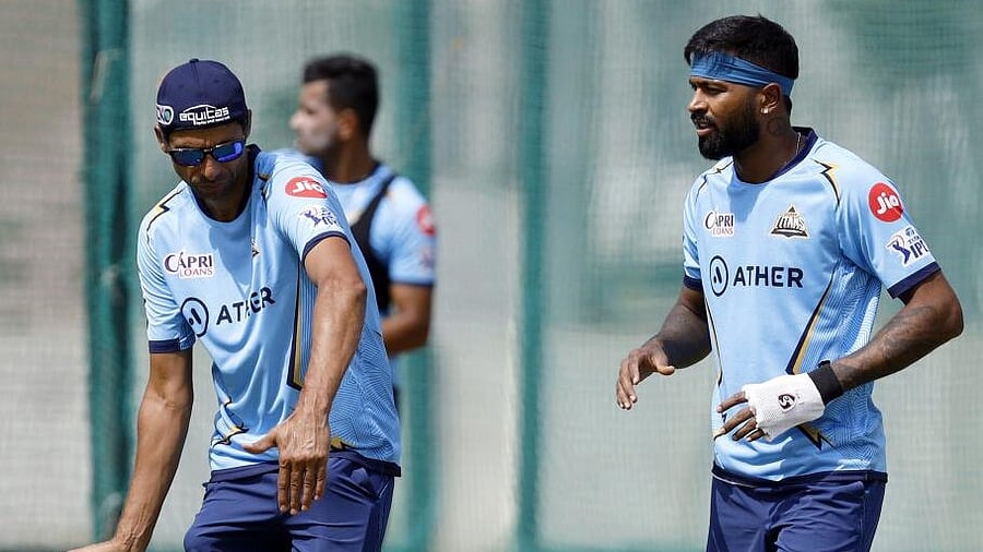 <div class="paragraphs"><p>File Photo: Hardik Pandya with Gujarat Titans coach Ashish Nehra during a practice session</p></div>