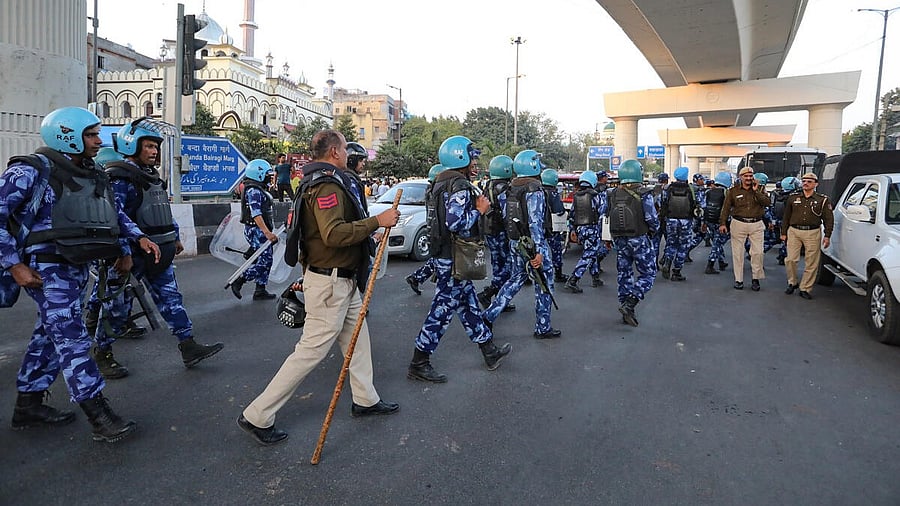 <div class="paragraphs"><p>Security personnel deployed at Inderlok area after a Delhi Police sub-inspector allegedly kicked a few people offering namaz on a road in the area, in New Delhi, Friday, March 8, 2024.</p></div>