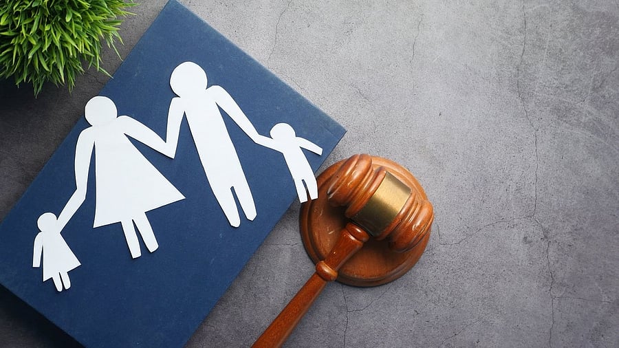 <div class="paragraphs"><p>Representative image of a gavel beside an adoption illustration. </p></div>