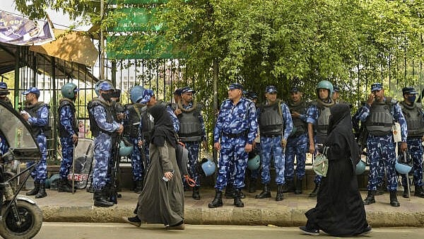 <div class="paragraphs"><p>Security personnel stand guard a day after the Ministry of Home Affairs notified the rules for implementation of the Citizenship (Amendment) Act, at Jamia in New Delhi, Tuesday, March 12, 2024.</p></div>