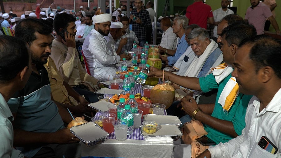 Sri Ullaklu Dhoomavathi Malaraya Daivastana administrative committee members, Muhiyuddin Juma Masjid members during Iftar get together at Masjid premises in Patrakodi in Kedila village of Bantwal taluk.