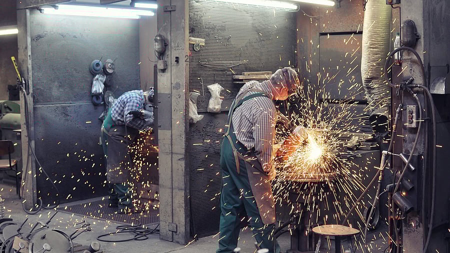 <div class="paragraphs"><p>Representative image showing factory workers in Germany.</p></div>