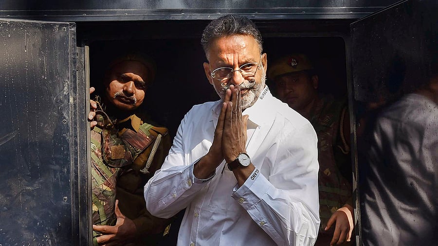 <div class="paragraphs"><p>File Photo: Gangster-turned-politician Mukhtar Ansari being produced at district court, in Prayagraj.</p></div>