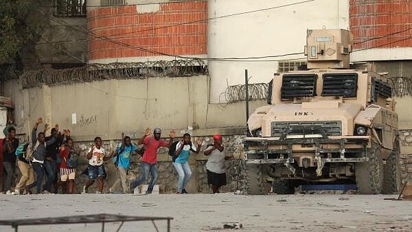 <div class="paragraphs"><p>People flee their homes due to gang violence, in Port-au-Prince.</p></div>