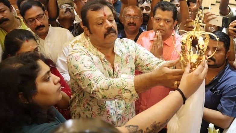 <div class="paragraphs"><p>Suresh Gopi places the crown at the church.&nbsp;</p></div>