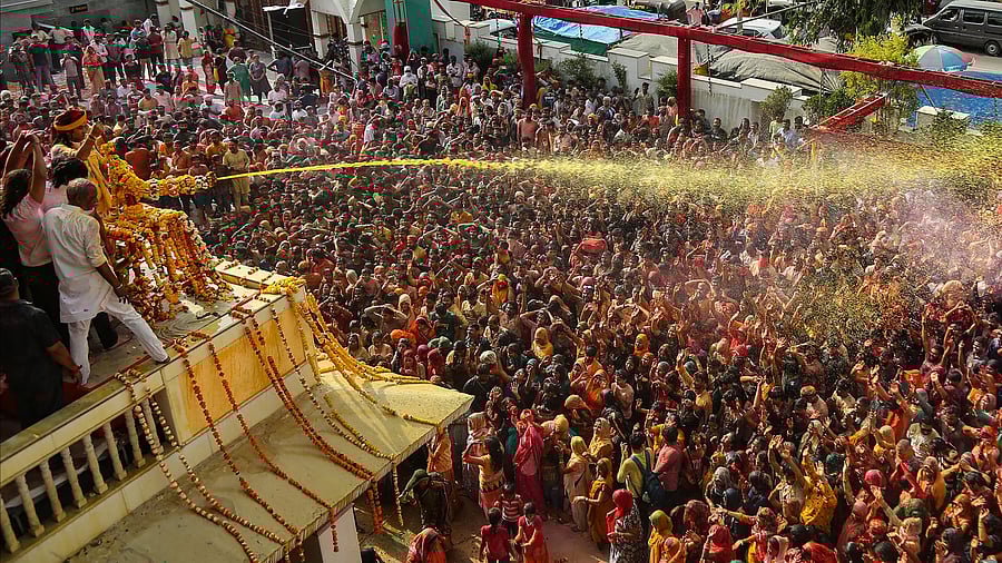 <div class="paragraphs"><p>Devotees play Holi at Shri Priyakantju temple in Vrindavan near Mathura.</p></div>