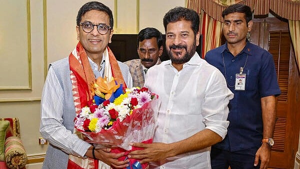 <div class="paragraphs"><p>Telangana Chief Minister A Revanth Reddy with Chief Justice of India Justice DY Chandrachud during a meeting, in Hyderabad, Thursday, March 28, 2024.</p></div>