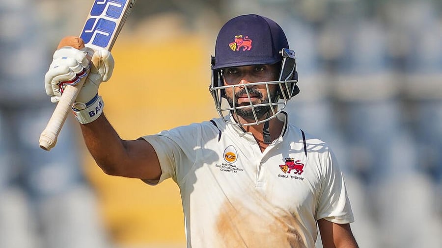 <div class="paragraphs"><p>Ajinkya Rahane celebrates after completing his half century against Vidarbha. </p></div>