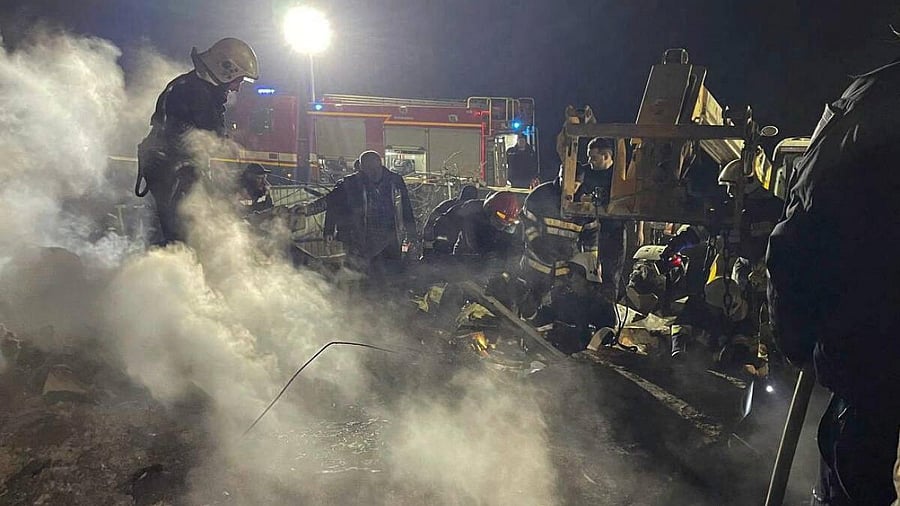 <div class="paragraphs"><p>Rescuers work at the site of a drone attack, amid Russia's attack on Ukraine, in a place given as Vinnitsya.</p></div>