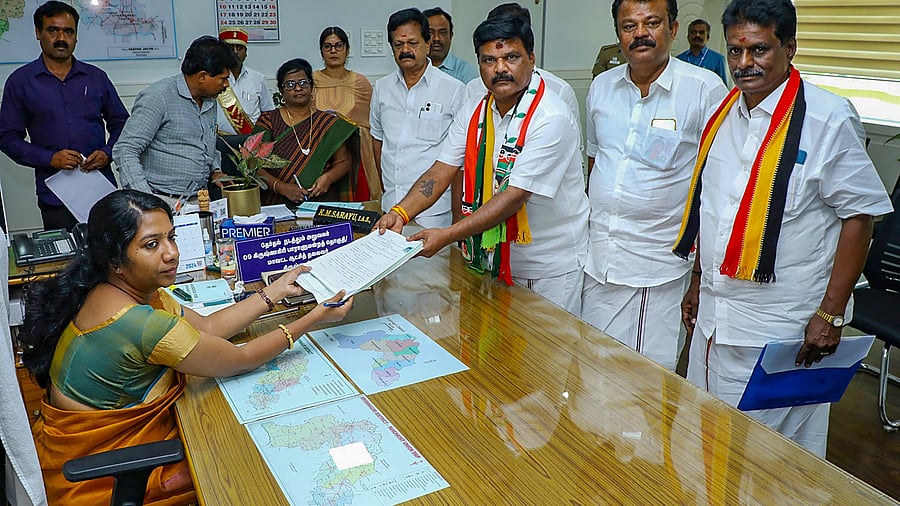 <div class="paragraphs"><p>AIADMK candidate for Krishnagiri Lok Sabha constituency Jayaprakash files his nomination papers before District Electoral Officer KM Sarayu, in Krishnagiri.</p></div>