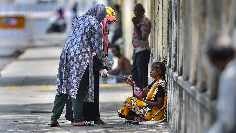 <div class="paragraphs"><p>Representative Image of poverty in India, and volunteers helping the poor survive.</p></div>