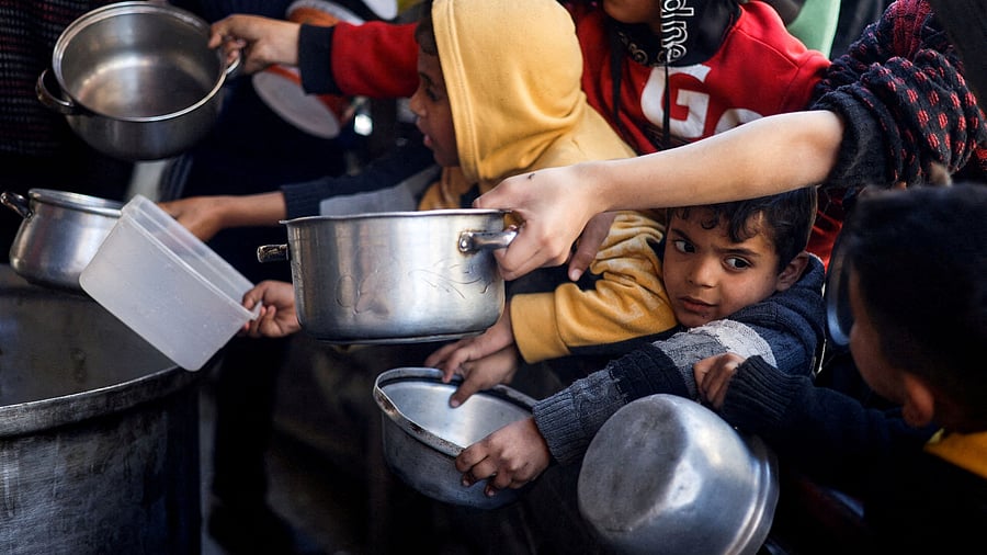 <div class="paragraphs"><p>A file photo of&nbsp;Palestinian children waiting to receive food cooked by a charity kitchen amid shortages of food supplies in Gaza Strip.</p></div>