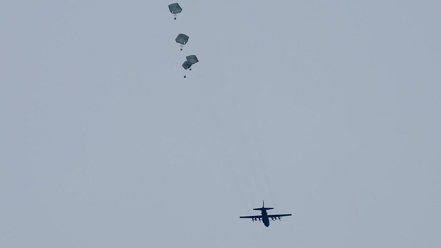 <div class="paragraphs"><p>Aid is air-dropped over Gaza, amid the ongoing the conflict between Israel and Hamas, in Rafah in the southern Gaza Strip.</p></div>