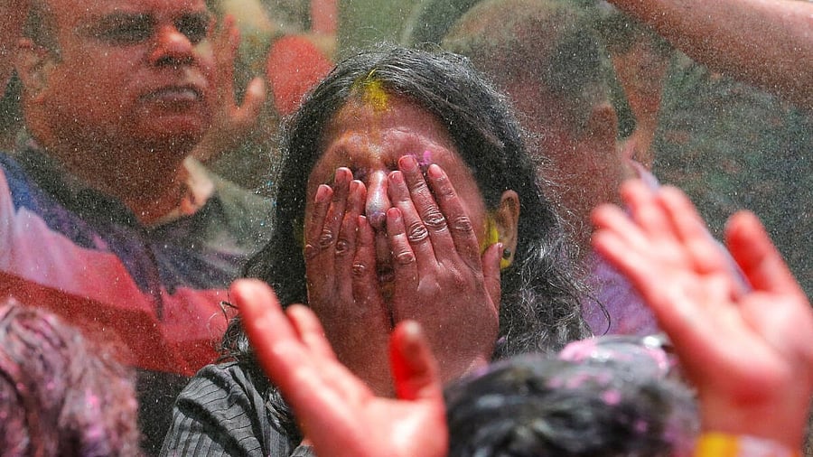 <div class="paragraphs"><p>A woman daubed with colour powders. Representative image for Holi celebration. </p></div>