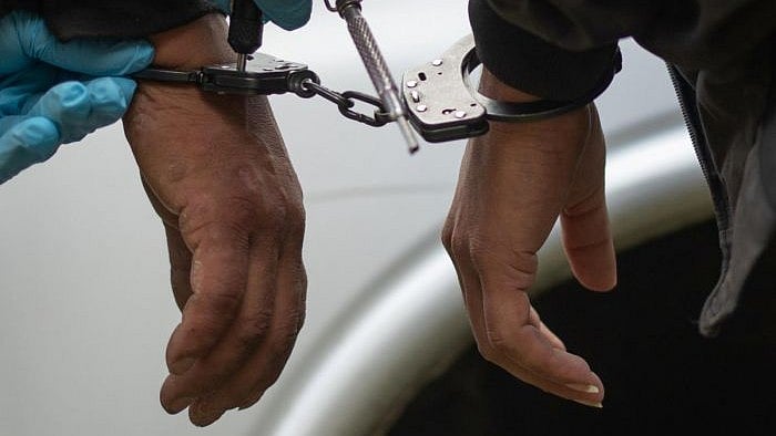 <div class="paragraphs"><p>Representative image showing two men handcuffed.</p></div>