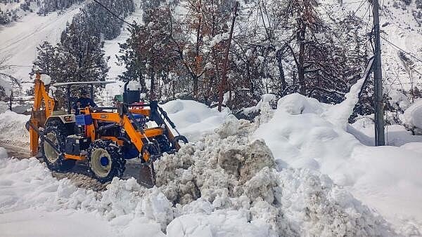 <div class="paragraphs"><p>A snow clearing machine being used to remove snow from a road at Sissu, in Lahaul and Spiti district.</p></div>