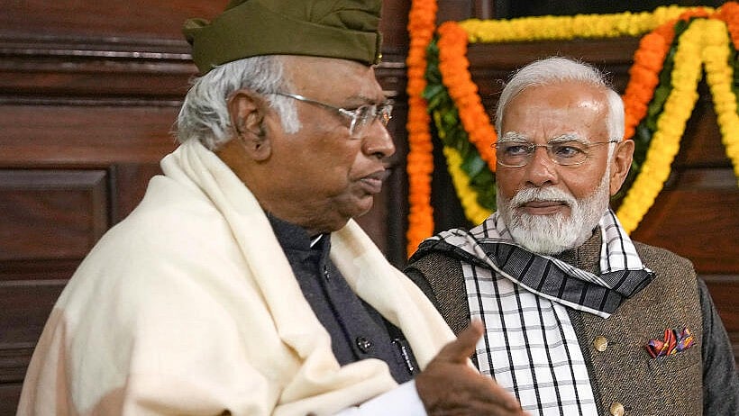 <div class="paragraphs"><p>Congress president Mallikarjun Kharge who is among the opposition members in the foreground with PM Narendra Modi looking on. </p></div>