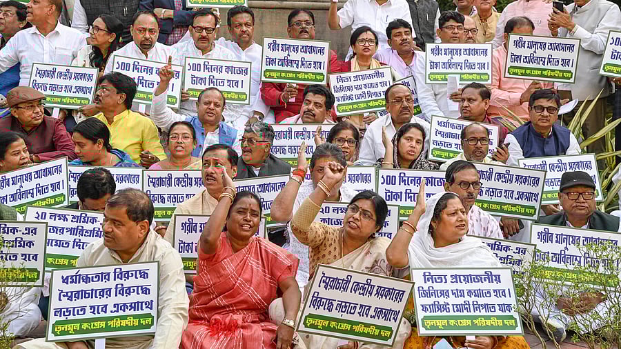 <div class="paragraphs"><p>A file photo of West Bengal ministers and TMC MLAs stage a sit-in protest against the Central government over the alleged denial of MGNREGA funds to the state government, in Kolkata.</p></div>