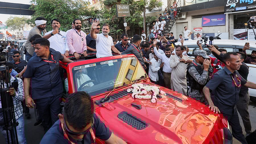 <div class="paragraphs"><p>Rahul Gandhi waves to his supporters at a roadshow during the "Bharat Jodo Nyay Yatra" in Jhalod town, in Gujarat.</p></div>