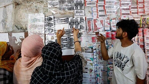 <div class="paragraphs"><p>Women shopping in a market in Kolkata.</p></div>
