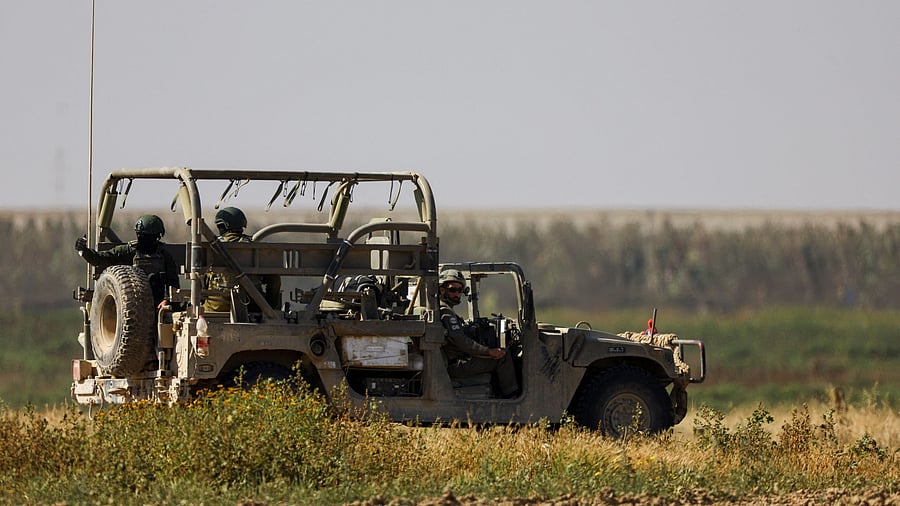 <div class="paragraphs"><p>An Israeli military vehicle manoeuvres, amid the ongoing conflict between Israel and the Palestinian Islamist group Hamas, near the Israel-Gaza border, as seen from Israel, April 4, 2024. </p></div>