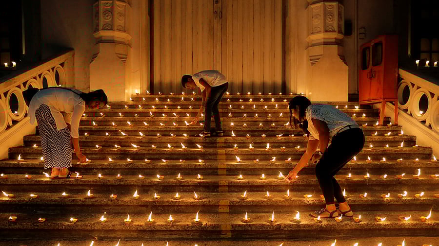 <div class="paragraphs"><p>File photo of people lighting candles during a vigil in memory of the victims of a string of suicide bomb attacks across the island on Easter Sunday, in Colombo, Sri Lanka onApril 28, 2019.</p></div>