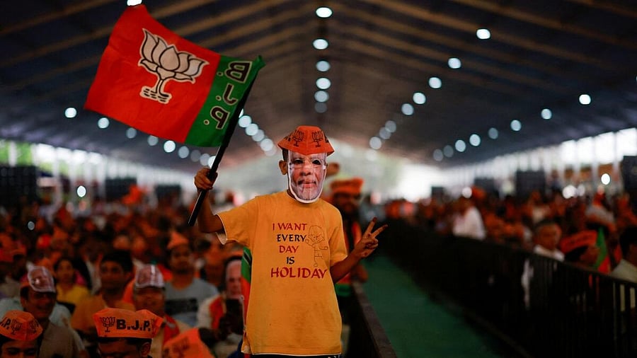 <div class="paragraphs"><p>A boy wearing a mask of India's Prime Minister Narendra Modi attends an election campaign in Bengaluru</p></div>
