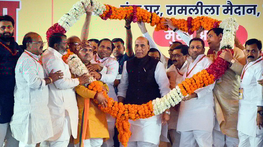 <div class="paragraphs"><p>Defence Minister Rajnath Singh being garlanded by BJP workers during a public meeting in support of BJP candidate Atul Garg ahead of upcoming Lok Sabha elections, in Ghaziabad, Wednesday, April 3, 2024. </p></div>