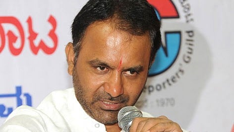 <div class="paragraphs"><p>District Minister Santosh Lad</p></div>