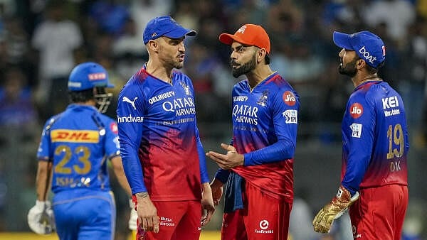 <div class="paragraphs"><p>Royal Challengers Bengaluru's Virat Kohli, Faf du Plessis and Dinesh Karthik during an IPL match.</p></div>