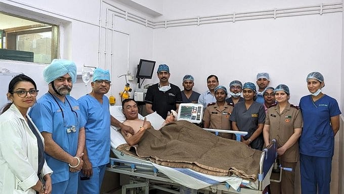 <div class="paragraphs"><p>The injured army personnel and his medical team.</p></div>