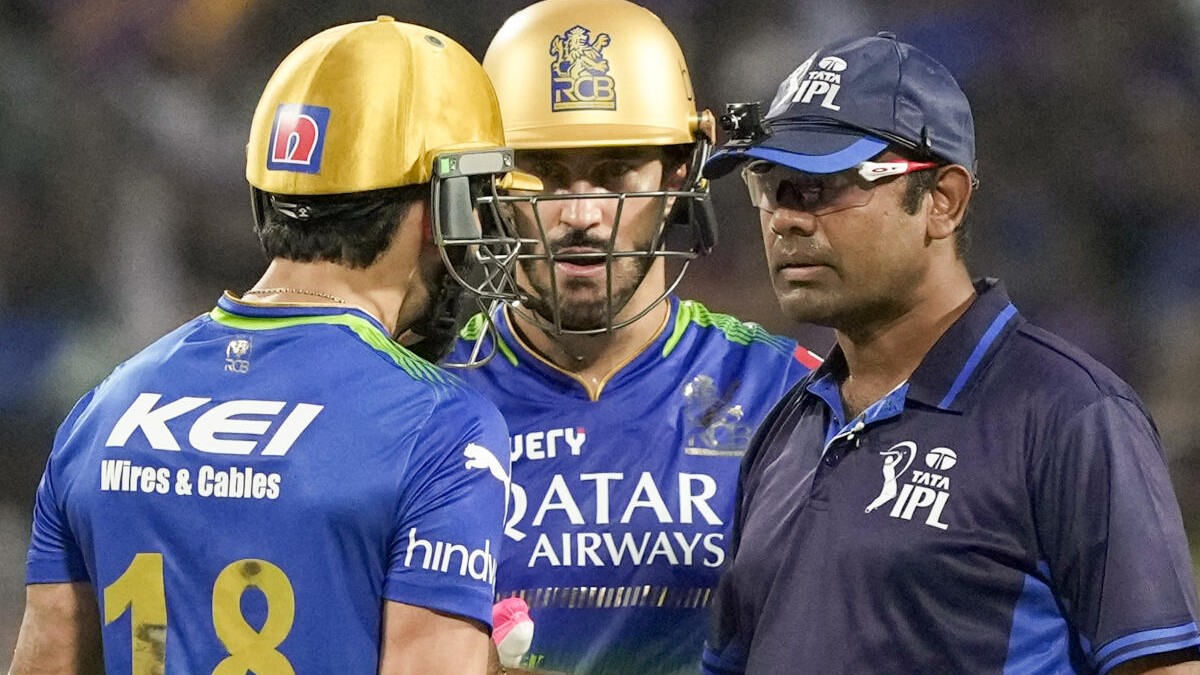 <div class="paragraphs"><p>RCB's Virat Kohli with captain Faf du Plessis interacts with the umpires after he was caught and bowled by KKKR's Harshit Rana during an IPL cricket match on Sunday. </p></div>