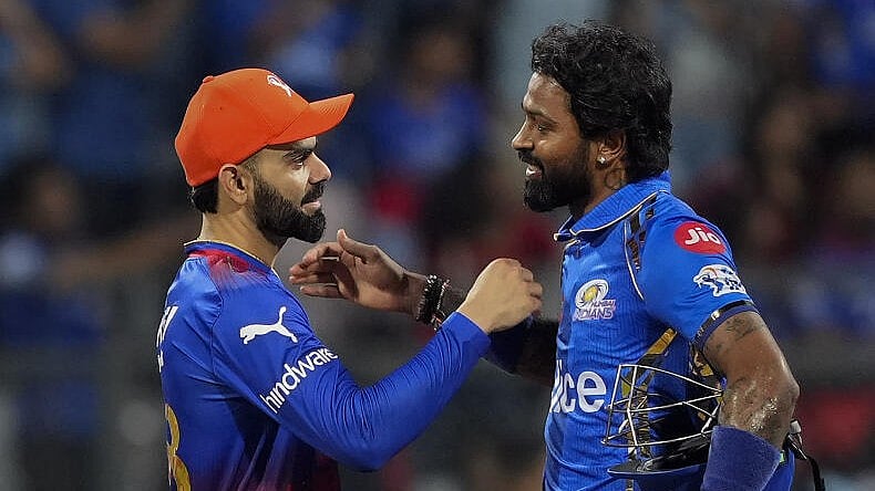 <div class="paragraphs"><p>Mumbai Indians captain Hardik Pandya and Royal Challengers Bengaluru's player Virat Kohli exchange greetings after the IPL 2024 cricket match against Royal Challengers Bengaluru and Mumbai Indians at Wankhede Stadium, in Mumbai, Thursday, April 11, 2024. </p></div>