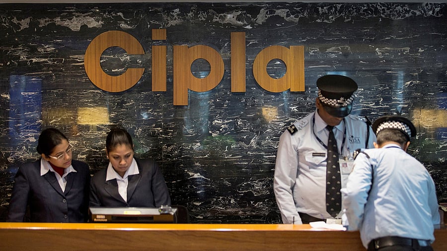 <div class="paragraphs"><p>Employees and security staff work at the reception area of Cipla.</p></div>