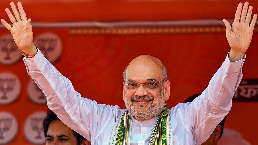 <div class="paragraphs"><p>Union Home Minister Amit Shah acknowledges the crowd during a public rally in Kumarghat, Tripura, on Monday, April 15.</p></div>