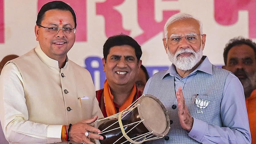 <div class="paragraphs"><p>Prime Minister Narendra Modi with Uttarakhand Chief Minister Pushkar Singh Dhami during a public meeting ahead of Lok Sabha elections, in Rishikesh, Thursday, April 11, 2024.</p></div>