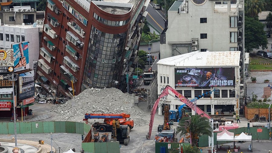 <div class="paragraphs"><p>People take part in a ceremony ahead of the demolition of a damaged building, following the earthquake, in Hualien, Taiwan April 5, 2024. </p></div>