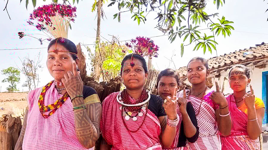 <div class="paragraphs"><p>Baiga tribal women show their fingers marked with indelible ink after casting their votes for the first phase of Lok Sabha elections, in Dindori district, Madhya Pradesh, Friday, April 19, 2024.</p></div>