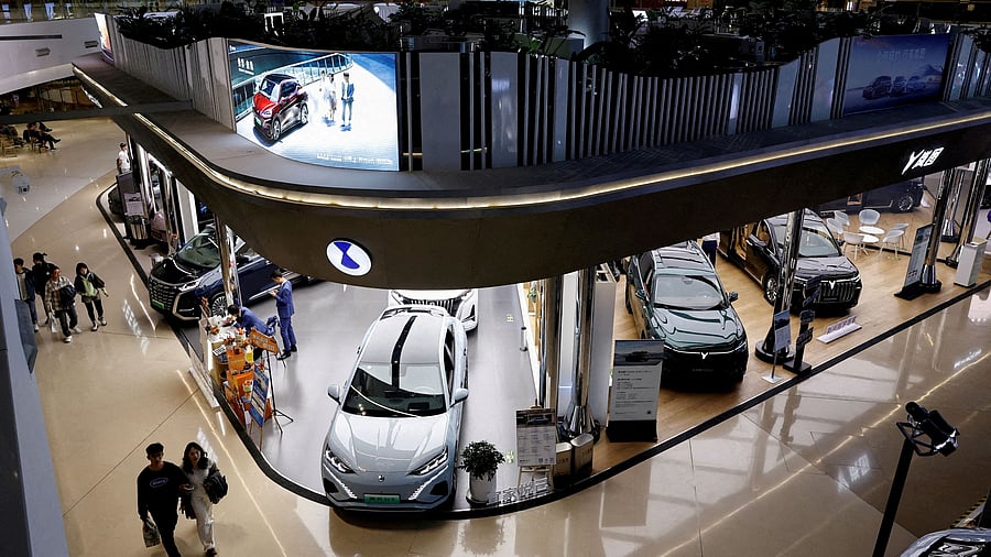 <div class="paragraphs"><p> Electric vehicle  models are displayed at the booths of Denza, a joint venture between Mercedes-Benz Group AG and BYD Auto, and Chinese EV maker Voyah, at a shopping mall in Beijing, China.</p></div>