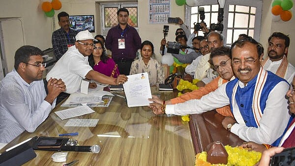 <div class="paragraphs"><p>Actor and BJP candidate Arun Govil (in orange 'kurta' on right) files his nomination for the upcoming Lok Sabha elections in presence of UP Deputy CM Keshav Prasad Maurya, in Meerut, Tuesday, April 2, 2024.</p></div>
