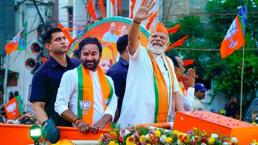 <div class="paragraphs"><p>Prime Minster Narendra Modi and Telangana BJP chief G Kishan Reddy during a road show at Malkajgiri in Hyderabad.</p></div>