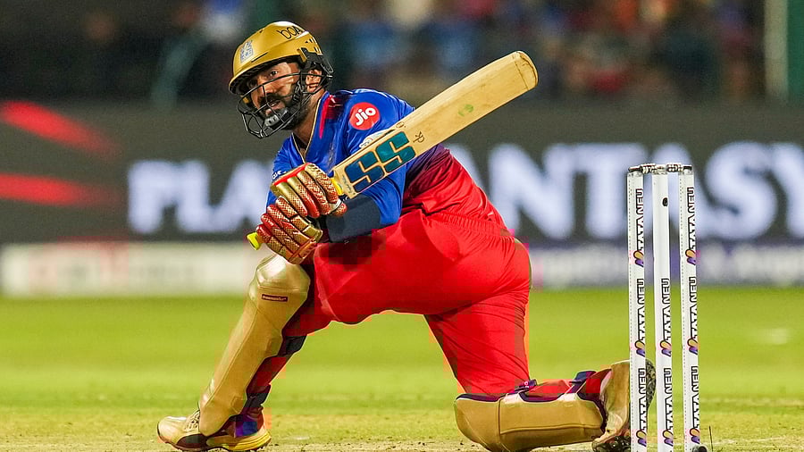 <div class="paragraphs"><p> Royal Challengers Bengaluru batter Dinesh Karthik plays a shot during the Indian Premier League (IPL) 2024 cricket match between Royal Challengers Bengaluru and Sunrisers Hyderabad, at M Chinnaswamy stadium in Bengaluru, Monday, April 15, 2024. </p></div>