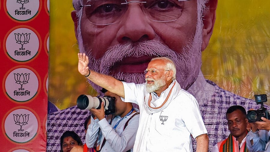 <div class="paragraphs"><p>Prime Minister Narendra Modi waves to supporters during an election campaign rally ahead of the upcoming Lok Sabha polls, in Cooch Behar. </p></div>