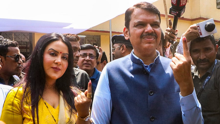 <div class="paragraphs"><p>Maharashtra Deputy Chief Minister Devendra Fadnavis shows his finger marked with indelible ink after casting his vote for the first phase of Lok Sabha&nbsp;elections,&nbsp;in Nagpur,&nbsp;Friday, April 19, 2024. </p></div>