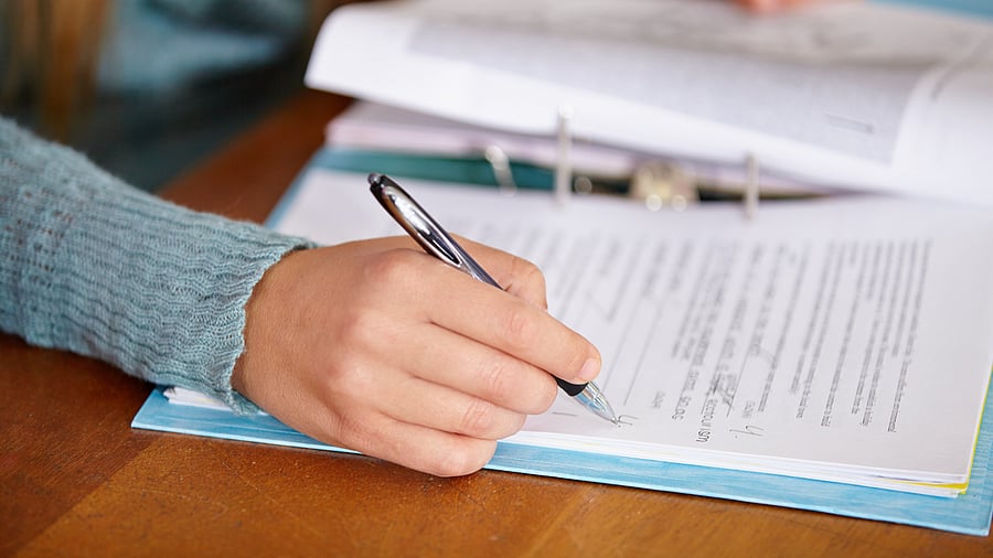 <div class="paragraphs"><p>Representational picture of a teacher marking a test. </p></div>