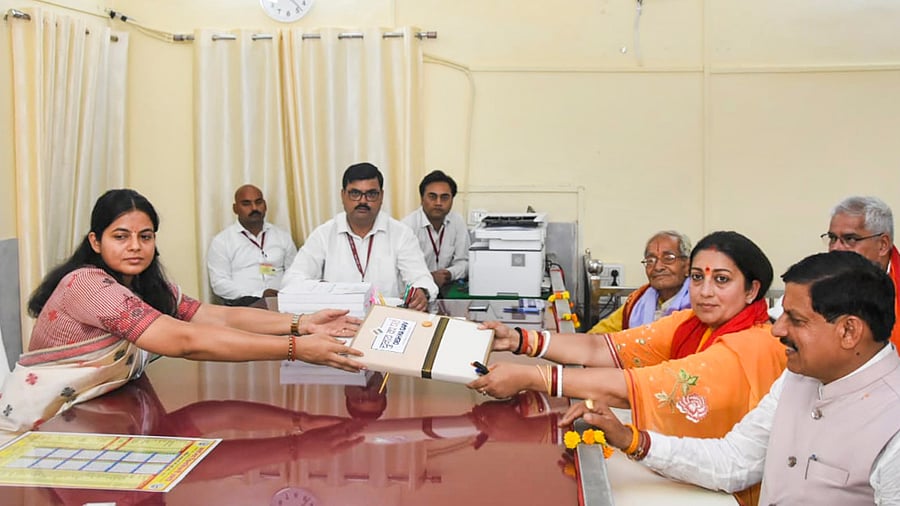 <div class="paragraphs"><p>Union Minister and BJP candidate Smriti Irani files her nomination for Lok Sabha elections, in Amethi, Monday, April 29, 2024. Madhya Pradesh Chief Minister Mohan Yadav is also seen.</p></div>