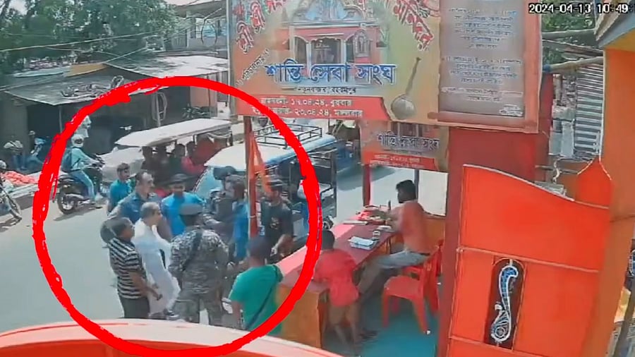 <div class="paragraphs"><p>Screengrab of video shared by TMC showing Adhir Ranjan Chowdhury, circled in red, getting into an altercation.</p></div>