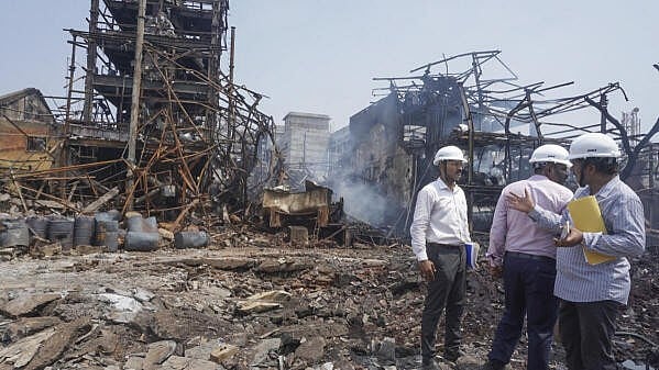 <div class="paragraphs"><p>Officials inside the chemical factory area at Dombivli where a blast  killed at least nine people and injured 60, in Thane district, Maharashtra.</p></div>