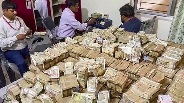 <div class="paragraphs"><p>Officials of the Enforcement Directorate recover 'unaccounted' cash during searches at the premises of a domestic help allegedly linked to the secretary of Jharkhand minister Alamgir Alam, in Ranchi.</p></div>